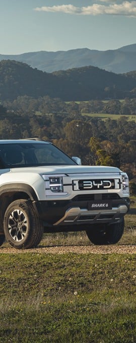 byd shark 6 charging on a hill
